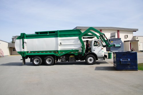 Mixed recycling containers and food waste caddies ready for collection