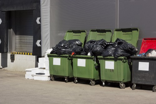 Staff segregating recyclable materials at a commercial premises